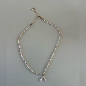 Elegant Beaded Necklace with Crescent Pendant